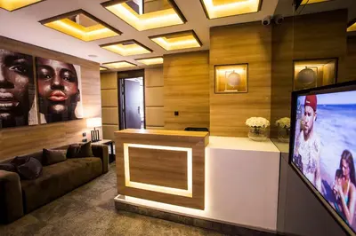 a living room with a flat screen tv and a couch at Eden Luxury Suites Terazije in Belgrade