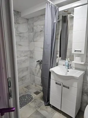 a bathroom with a sink and a shower at Studio Dana in Arandjelovac