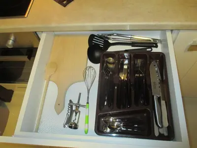a tray with utensils on top of a counter at Genex Apartment in Belgrade