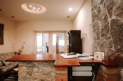 a stone desk in a room with a stone wall at Apartman Milenijum in Belgrade