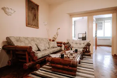 a living room with a couch and a coffee table at Apartman Milenijum in Belgrade