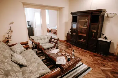 a living room with a couch and a table at Apartman Milenijum in Belgrade