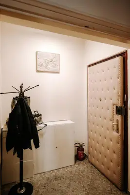 an open door in a room with a white wall at Apartman Milenijum in Belgrade