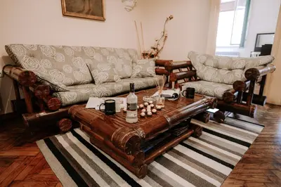 a living room with a couch and a table at Apartman Milenijum in Belgrade
