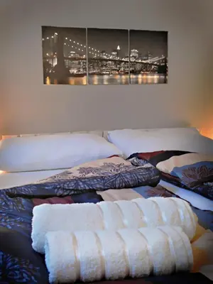 two beds with towels on them in a bedroom at Banshill Apartment in Belgrade