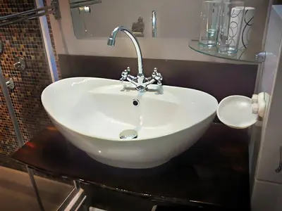 a white sink sitting on a counter in a bathroom at Banshill Apartment in Belgrade