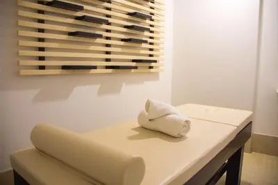 a white table with a towel sitting on top of it at Xenon Hotel & SPA in Belgrade
