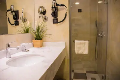 a bathroom with a sink and a shower at Xenon Hotel & SPA in Belgrade