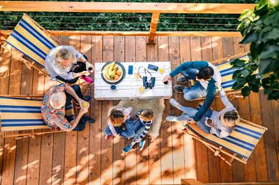 an overhead view of a group of people sitting around a table at Laguna Platz in Sremski Karlovci