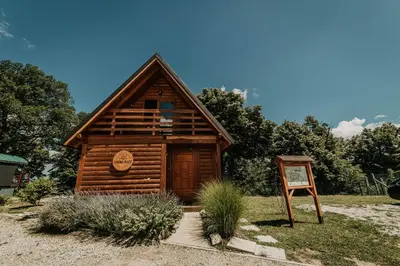 a small log cabin with a sign in front of it at Laguna Platz in Sremski Karlovci