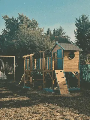 a wooden playground with a wooden play structure at Laguna Platz in Sremski Karlovci