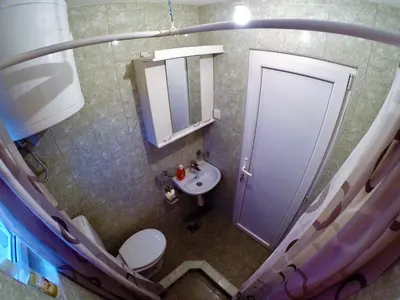 a small bathroom with a toilet and a sink at Apartments Popovic in Belgrade