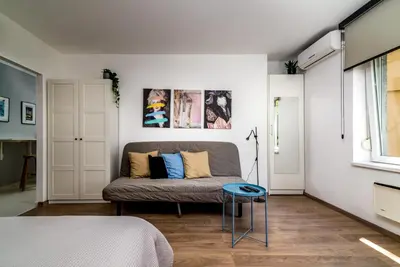 a living room with a couch and a table at Cozy Central Studio - Steps from Knez Mihailova in Belgrade
