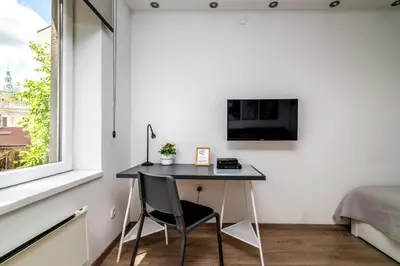 a small desk in a room with a window at Cozy Central Studio - Steps from Knez Mihailova in Belgrade