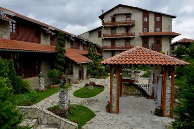 a large building with a gazebo in front of it at Hotel Centar Balasevic in Belgrade