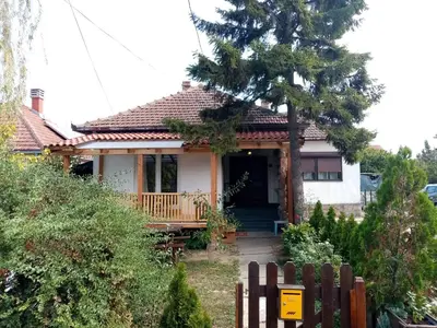 a house with a fence in front of it at Apartman Otvoreno polje in Arandjelovac