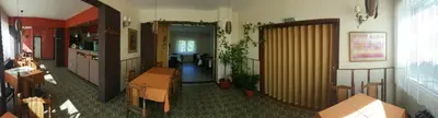 a room with a hallway with a table and a room with at Guest House Major in Arandjelovac