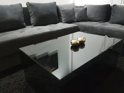 a living room with a couch and a coffee table at Apartments Villa White House in Pančevo