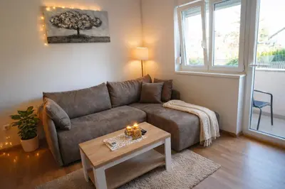 a living room with a couch and a table at President 034 in Arandjelovac