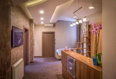 a hotel room with a bedroom with a bed at Veneti Suites in Belgrade