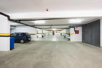 a parking garage with a car parked in it at Garni Hotel Nevski in Belgrade
