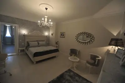 a bedroom with a bed and a mirror on the wall at Margot Luxury Studio in Belgrade
