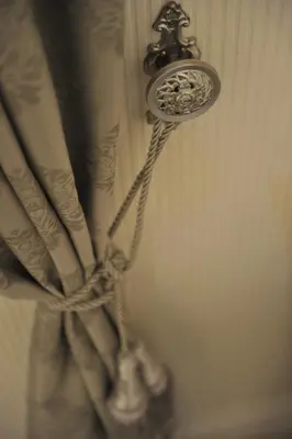 a close up of a shower curtain with a curtain at Margot Luxury Studio in Belgrade