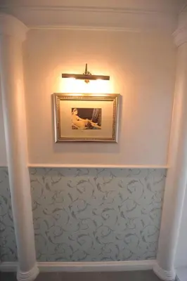a ceiling with a picture and a ceiling fan at Margot Luxury Studio in Belgrade