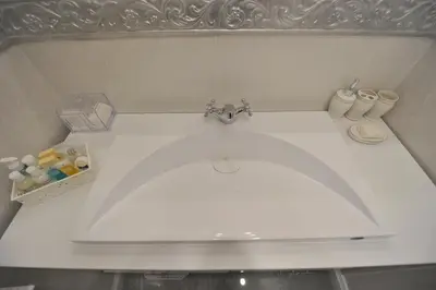 a bathroom with a sink with a faucet at Margot Luxury Studio in Belgrade