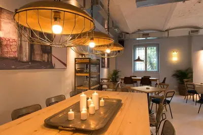 a dining room with a table with candles on it at Smokvica Dorćol B&B in Belgrade