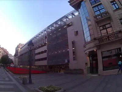a large building with a lot of windows at Double Decker Apartment in Belgrade
