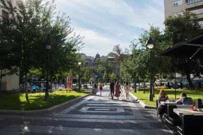 a group of people walking in a park at Double Decker Apartment in Belgrade