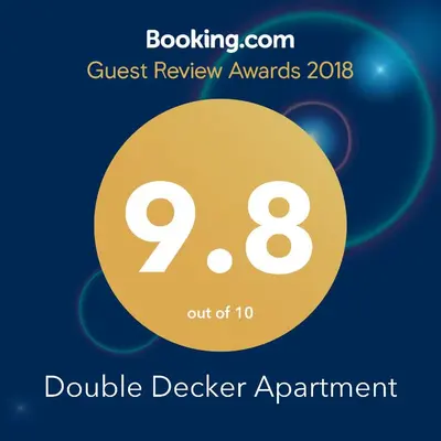 a flyer for the double dealer agreement with a yellow circle at Double Decker Apartment in Belgrade
