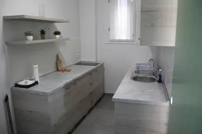 a kitchen with a sink and a counter top at Rooftop Apartment Belgrade in Belgrade