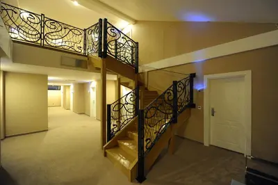 a spiral staircase in a house with a hallway at Hotel 1000 Ruza in Belgrade