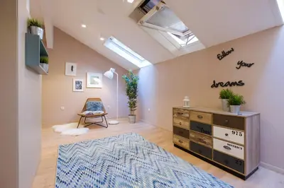 a room with a dresser and a blue rug at Lella Apartment 2 - duplex - epicenter of Belgrade in Belgrade