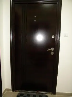 a black door in a room with a tile floor at Apartment Srebrni oblak in Arandjelovac