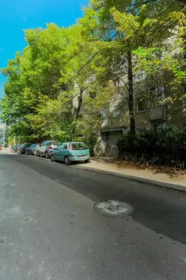 a street with cars parked on the side of the road at Apartman Gloria 2 in Belgrade