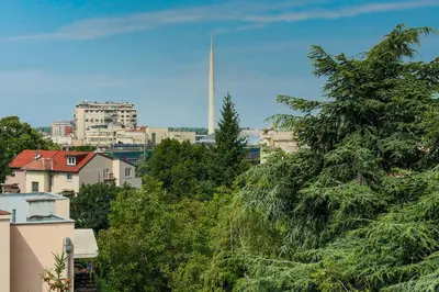a view of a city with a white tower in the distance at Apartman Gloria 2 in Belgrade