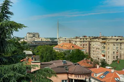 a city with buildings and a bridge in the background at Apartman Gloria 2 in Belgrade
