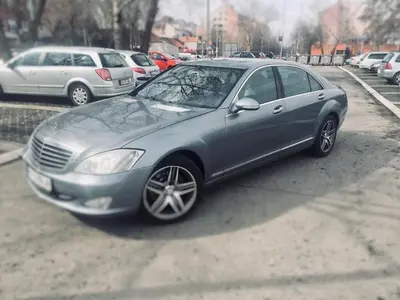 a silver car parked in a parking lot at Centrally Located Relaxing Place in Belgrade