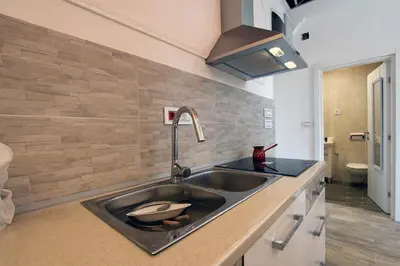 a kitchen sink with a bowl in it at Centrally Located Relaxing Place in Belgrade