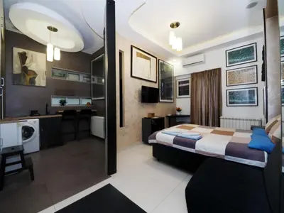 a hotel room with a bed and a bathroom at KennedyLux Apartment in Belgrade
