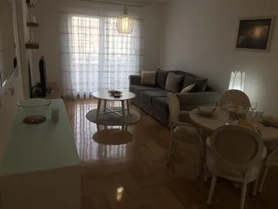 a living room with a couch and a table at Apartment Posejdon in Belgrade