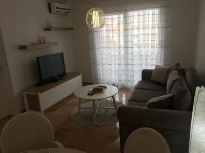 a living room with a couch and a table at Apartment Posejdon in Belgrade