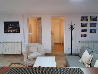 a living room with a couch and a chair at Apartment Queen in Belgrade
