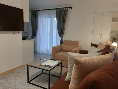 a living room with a couch and a table at Apartment Queen in Belgrade