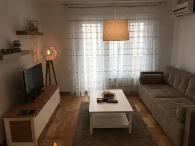 a living room with a couch and a coffee table at Apartment Triton in Belgrade