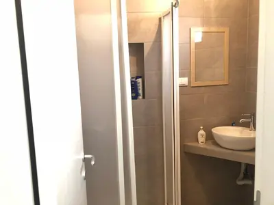 a bathroom with a sink and a mirror at Studio 50 with Terrace in Belgrade