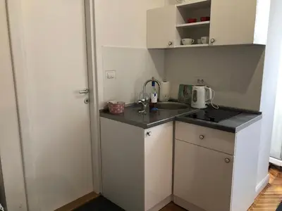 a small kitchen with a sink and a counter at Studio 50 with Terrace in Belgrade